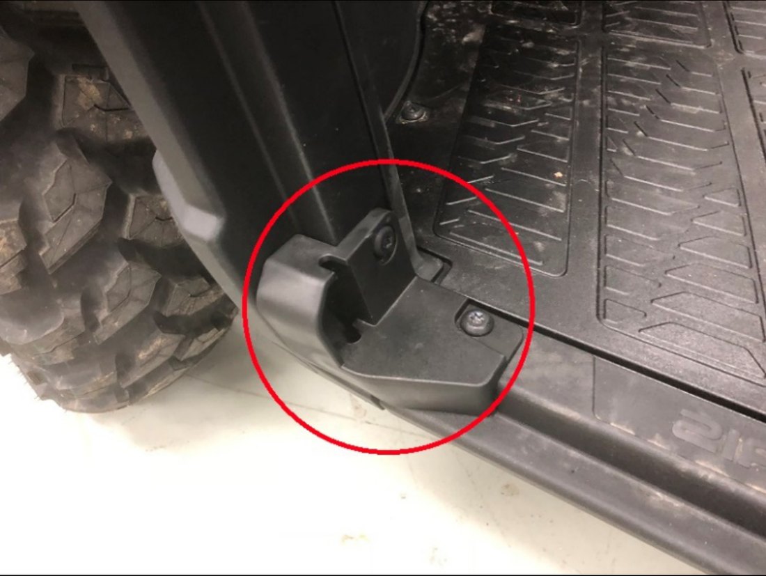 Lower front net attachment and plastic retainer circled at the floor of the Ranger