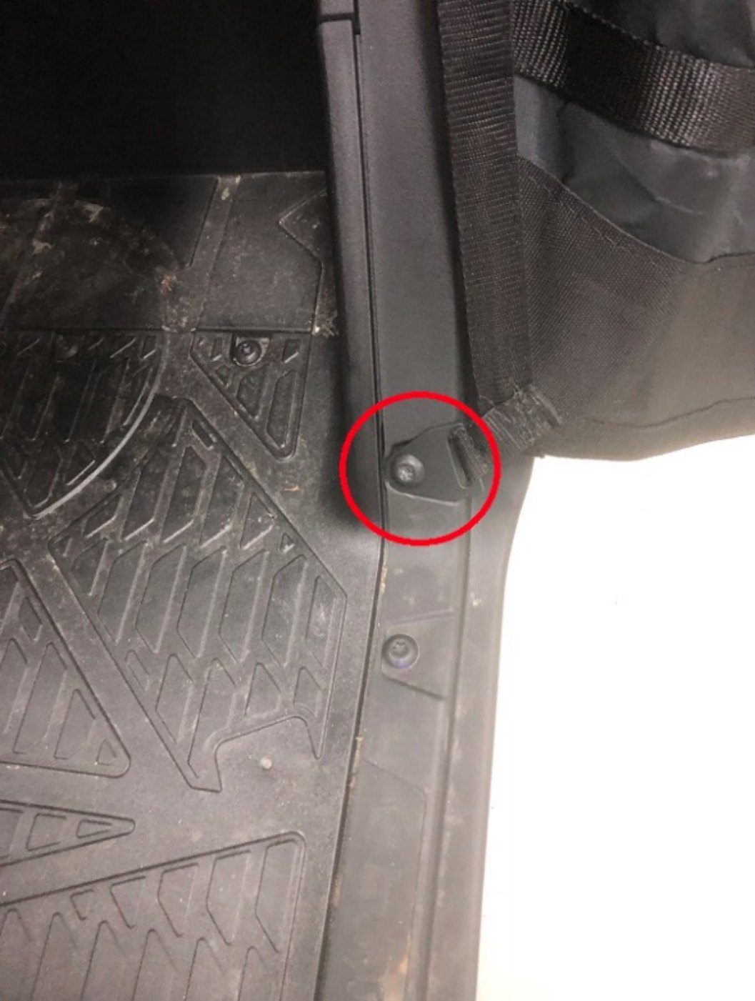 Lower rear net bracket circled at the floor of the Ranger XP 1000