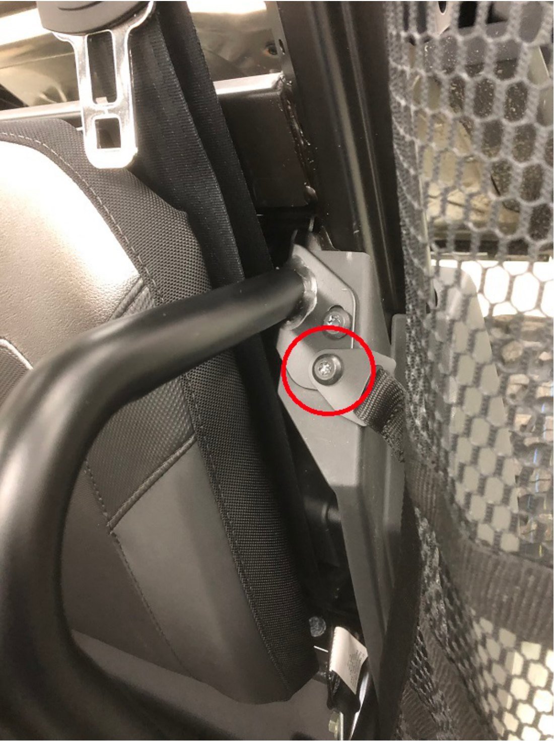 Net bracket behind the seat, secured with an 8mm bolt and nut