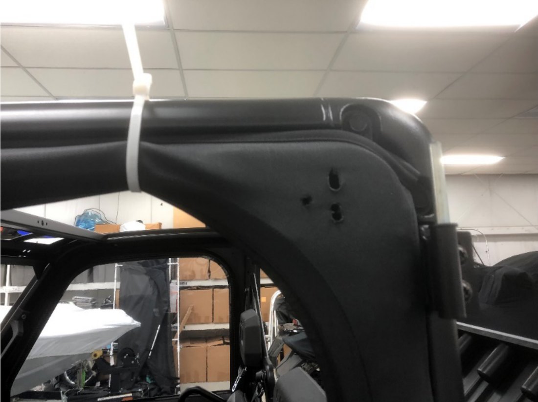 Door set into the Ranger frame and held with a zip tie at the top rear