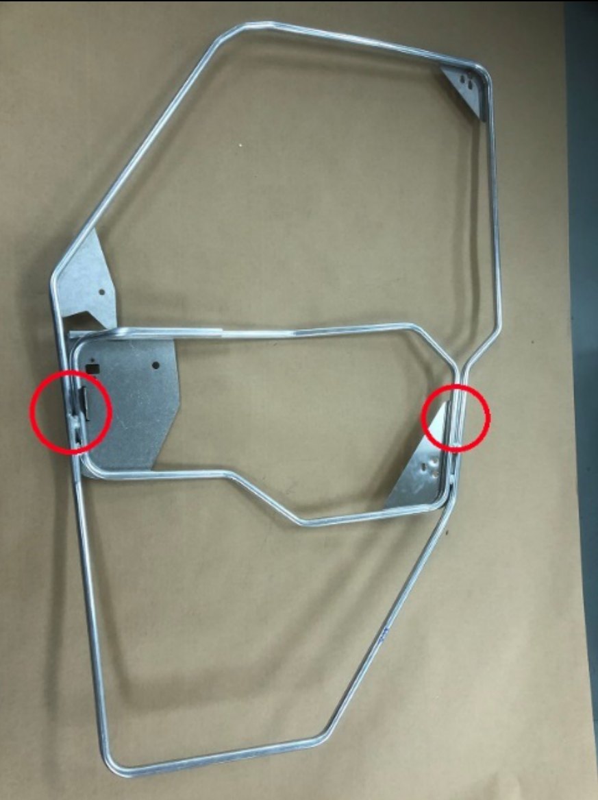 Upper and lower Spike door frame sections joined, joints circled