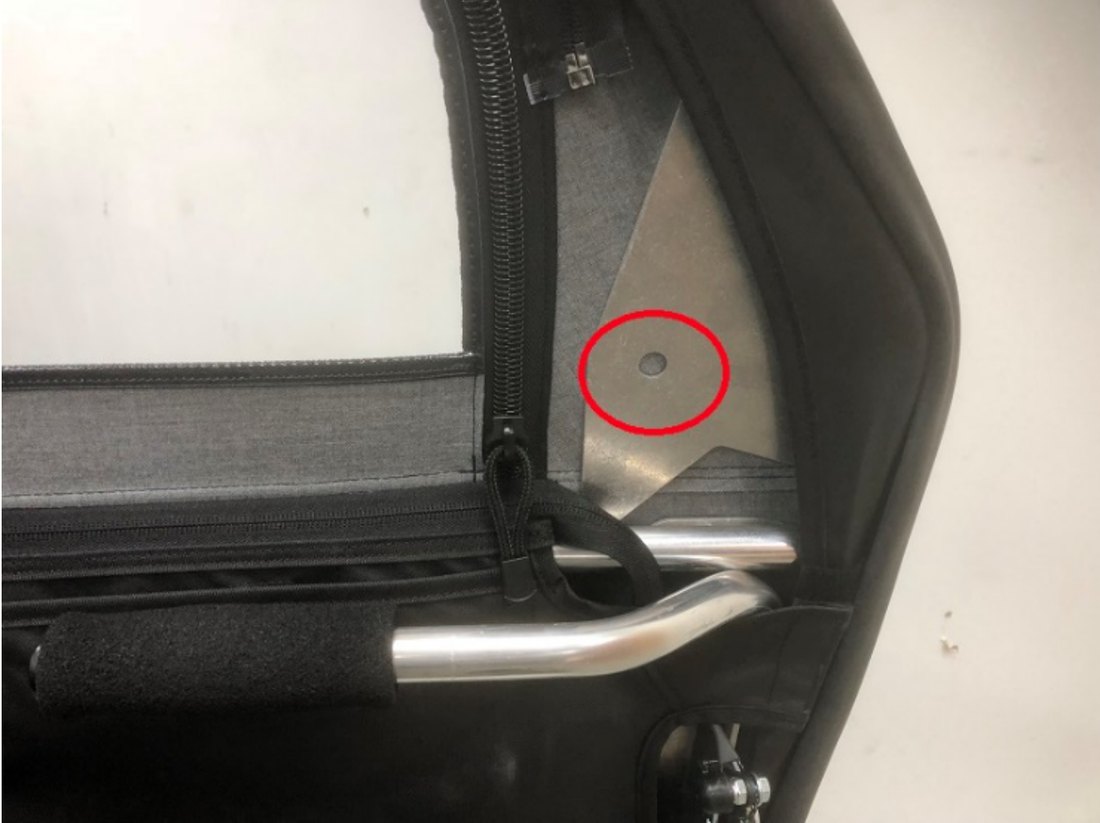 Side mirror mounting provision circled on the door frame plate